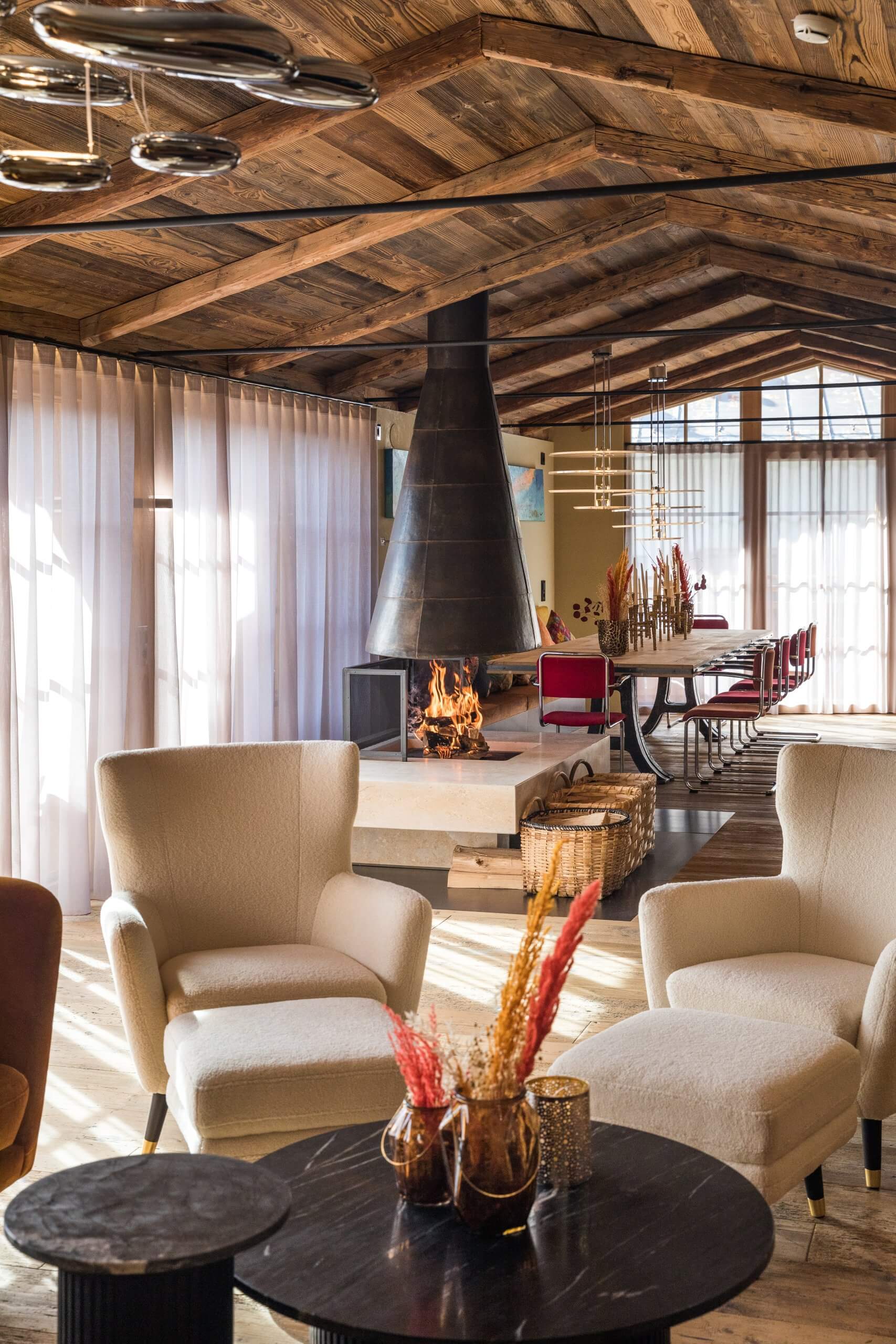 Royal Suite at St Anton with armcharis and fireplace. Part of the luxury chalet club collection
