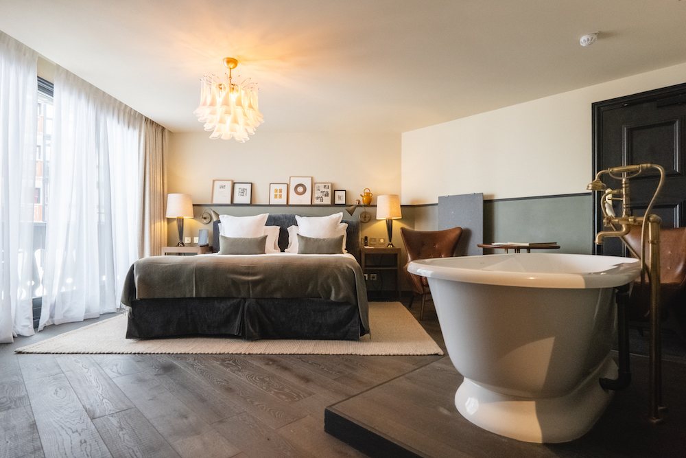 Bedroom with bathtub in room. Part of the luxury chalet club collection